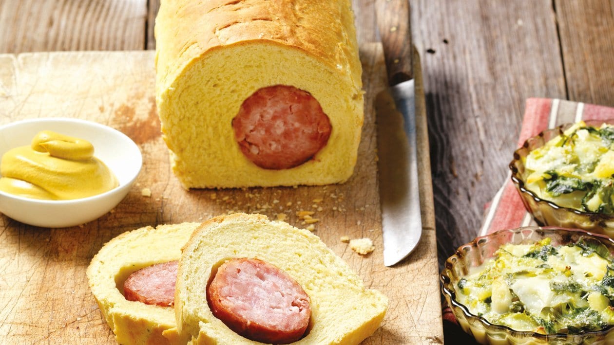 Waadtländer Saucisson im Brioche-Teig mit Kartoffel-Lauch-Töpfli Waadtländer Saucisson im Brioche-Teig mit Kartoffel-Lauch-Töpfli