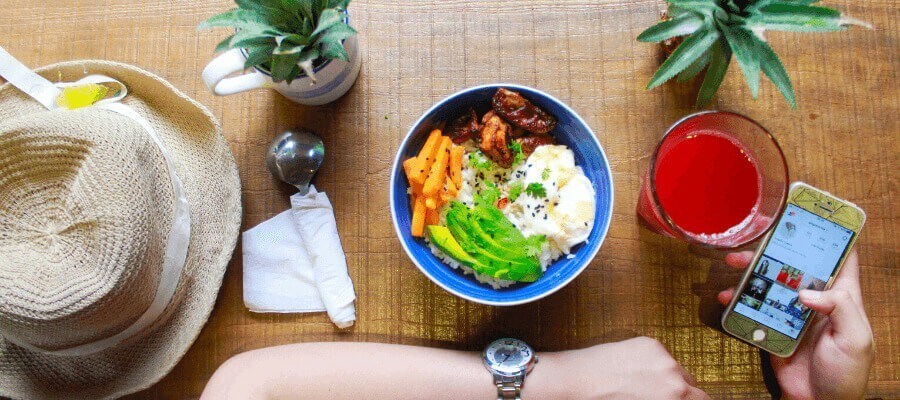 person taking photo of food salad bowl person taking photo of food salad bowl